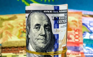 Тенге укрепился к доллару после заявления Нацбанка о 'ястребиных' мерах